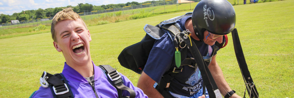 Pair of Skydivers Looking Extremely Happy after Jumping