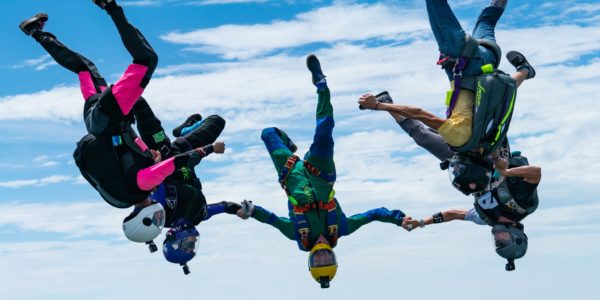 group of skydivers upsidedown