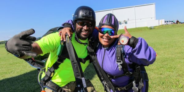 tandem skydiving beginner excited after landing